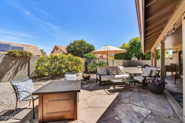 view of patio with an outdoor hangout area and a fenced backyard