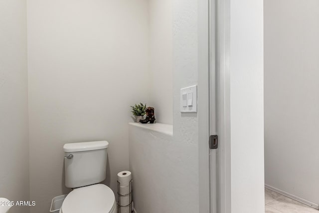 bathroom featuring tile patterned floors and toilet