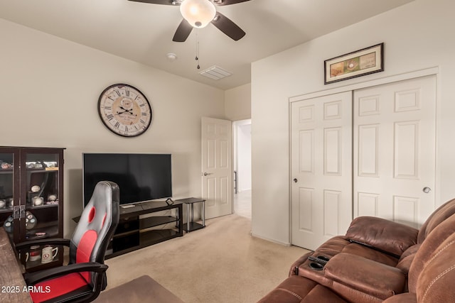 office area featuring light colored carpet and ceiling fan