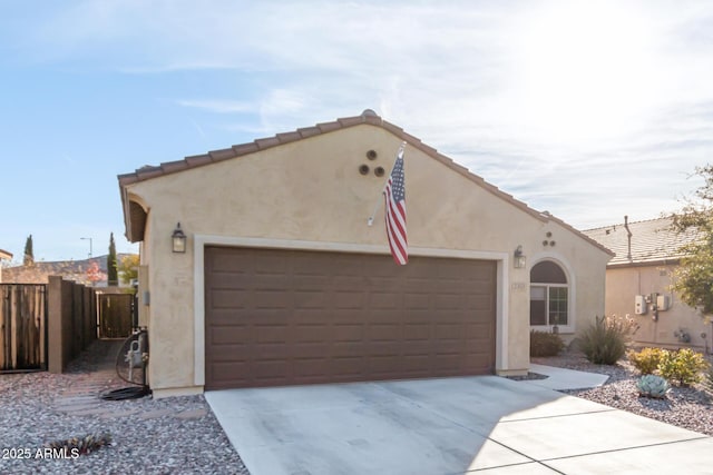 mediterranean / spanish-style house featuring a garage