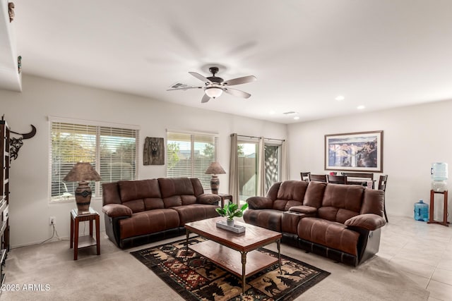 tiled living room featuring ceiling fan