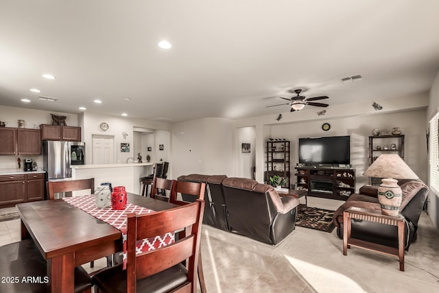 dining room featuring ceiling fan and light tile patterned floors