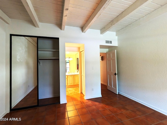 unfurnished bedroom with wood ceiling, beamed ceiling, tile patterned flooring, and visible vents