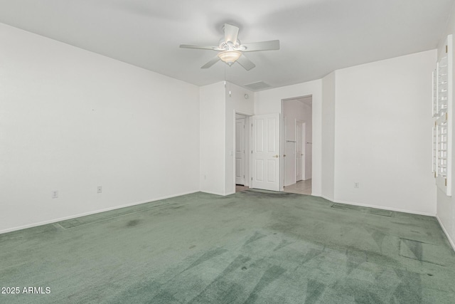 unfurnished room featuring carpet flooring, visible vents, and baseboards