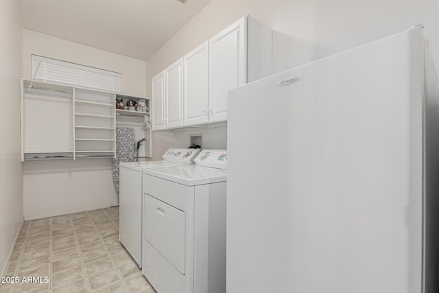 laundry room with cabinet space and washing machine and dryer