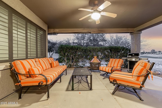 view of patio with a ceiling fan, a grill, and an outdoor living space