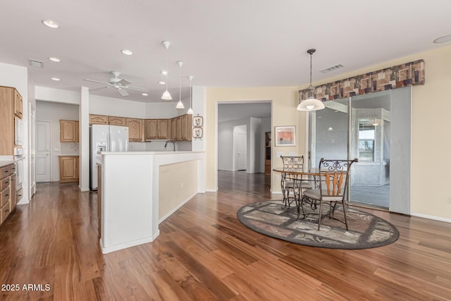 dining area with baseboards, visible vents, ceiling fan, wood finished floors, and recessed lighting