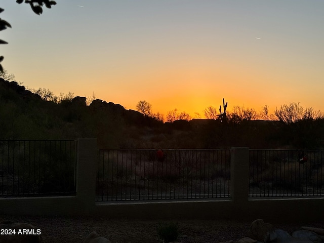 view of gate at dusk