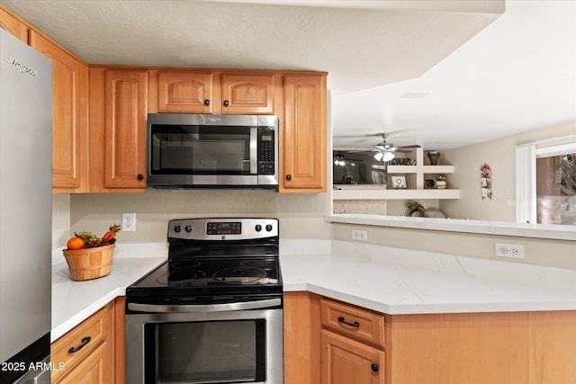 kitchen with ceiling fan and appliances with stainless steel finishes