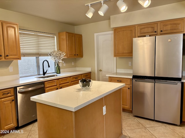 kitchen featuring sink, stainless steel appliances, light tile patterned floors, and a center island