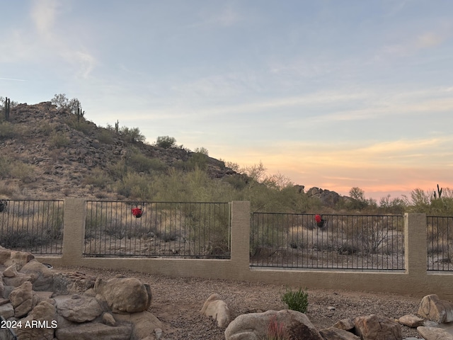 view of gate at dusk