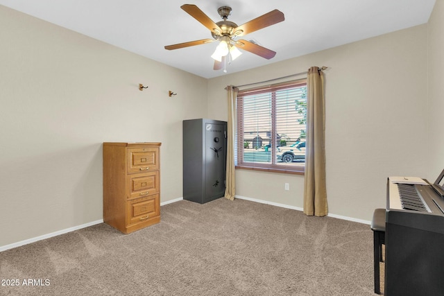 misc room featuring ceiling fan, light carpet, and baseboards
