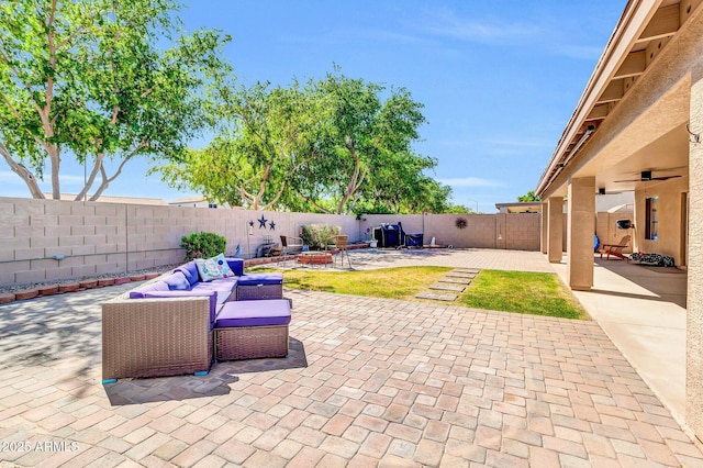 view of patio with a fenced backyard and a fire pit