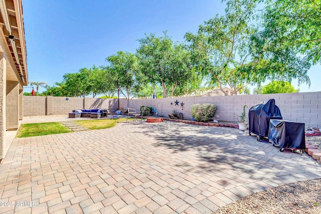view of patio featuring grilling area and a fenced backyard