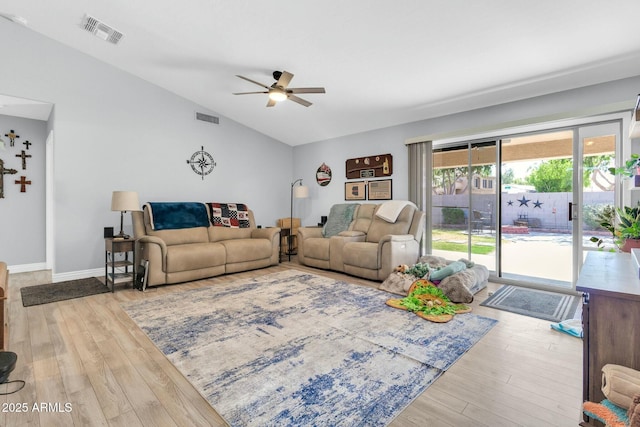 living room featuring visible vents, a ceiling fan, wood finished floors, and lofted ceiling