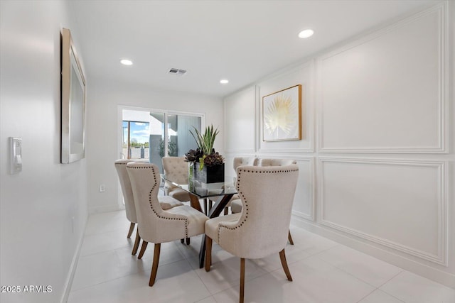 dining area featuring light tile patterned floors