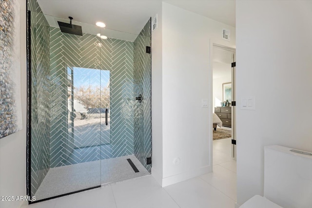 bathroom with a shower with door and tile patterned flooring