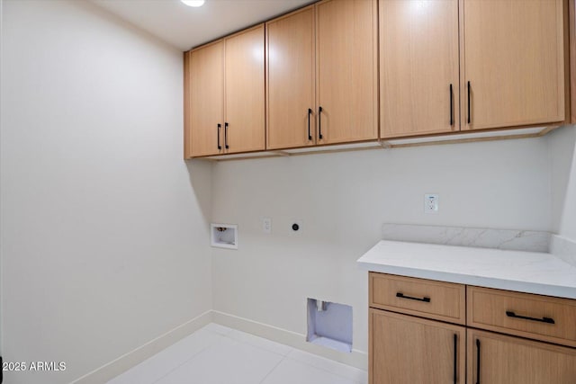 laundry room featuring light tile patterned flooring, washer hookup, cabinets, and hookup for an electric dryer