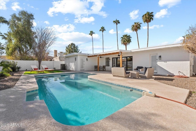 view of pool featuring a patio area, ceiling fan, and an outdoor living space