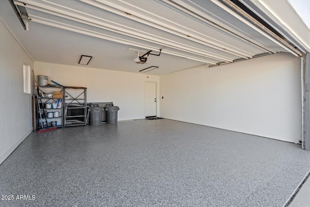 garage featuring a garage door opener