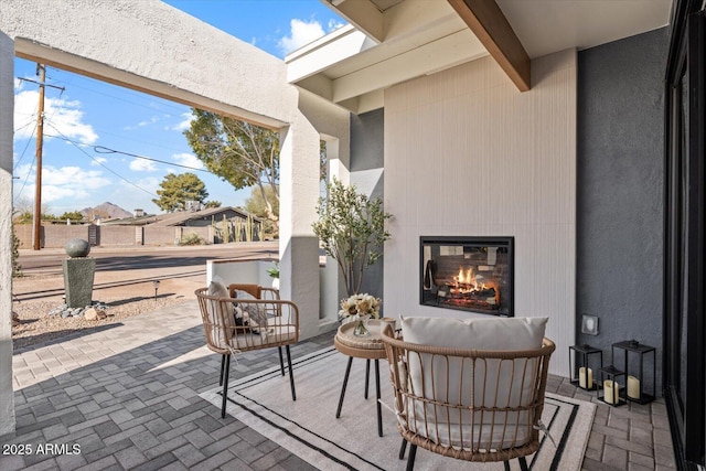 view of patio / terrace with a large fireplace