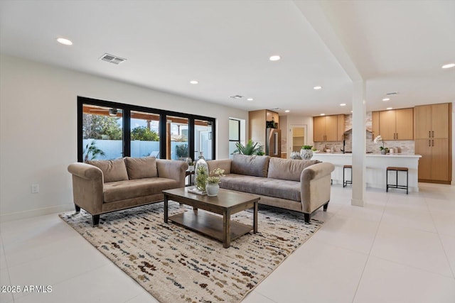 living room with light tile patterned floors