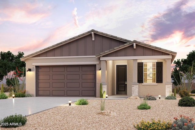 ranch-style home featuring stucco siding, board and batten siding, concrete driveway, and an attached garage