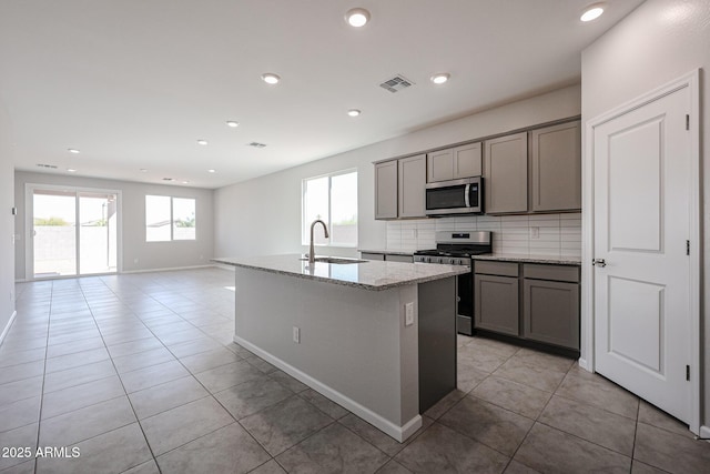19115 N Los Gabrieles Way, Maricopa, AZ 85138 - kitchen featuring appliances with stainless steel finishes, a sink, gray cabinets, light tile patterned flooring, and recessed lighting