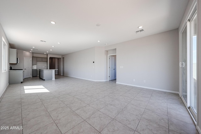 19115 N Los Gabrieles Way, Maricopa, AZ 85138 - unfurnished living room featuring recessed lighting, light tile patterned floors, and baseboards
