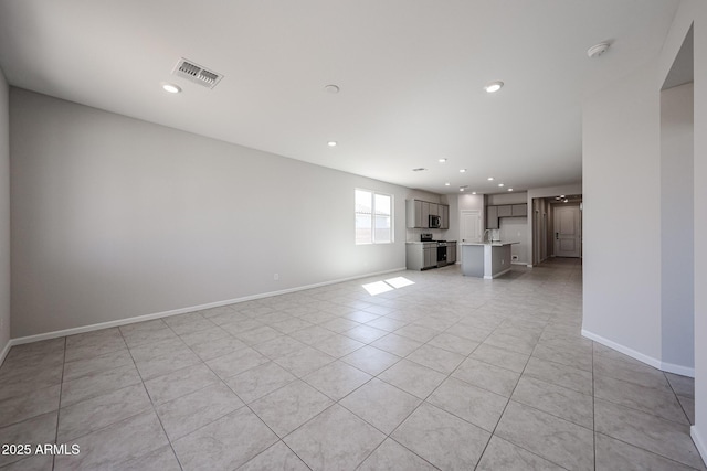 19115 N Los Gabrieles Way, Maricopa, AZ 85138 - unfurnished living room featuring light tile patterned flooring, recessed lighting, and baseboards