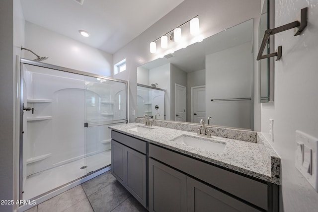 19115 N Los Gabrieles Way, Maricopa, AZ 85138 - bathroom featuring a stall shower, double vanity, and tile patterned flooring