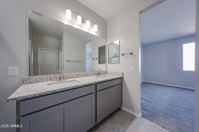 19115 N Los Gabrieles Way, Maricopa, AZ 85138 - full bathroom featuring double vanity, baseboards, and tile patterned flooring