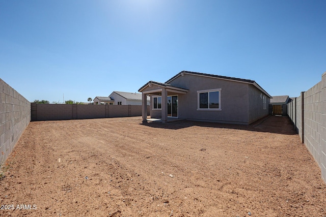 19115 N Los Gabrieles Way, Maricopa, AZ 85138 - rear view of property featuring a fenced backyard and stucco siding