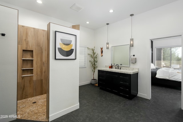 bathroom with a shower and vanity