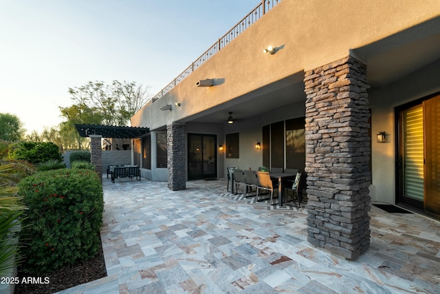 patio terrace at dusk with a pergola