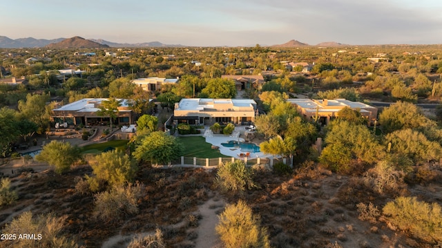 aerial view at dusk with a mountain view