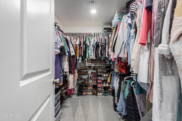 spacious closet with carpet floors and visible vents