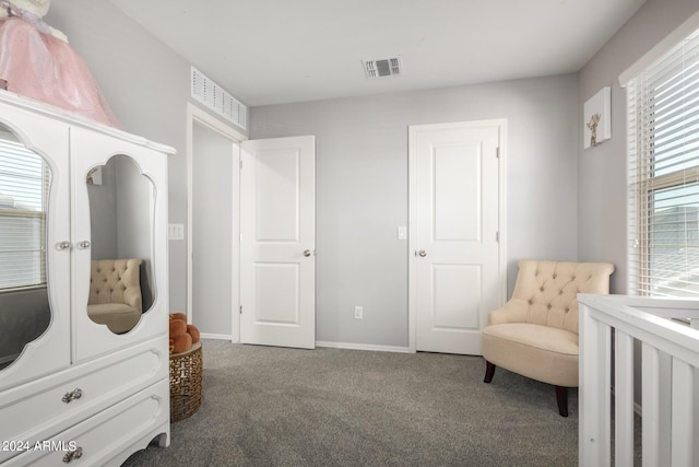 carpeted bedroom featuring visible vents and baseboards