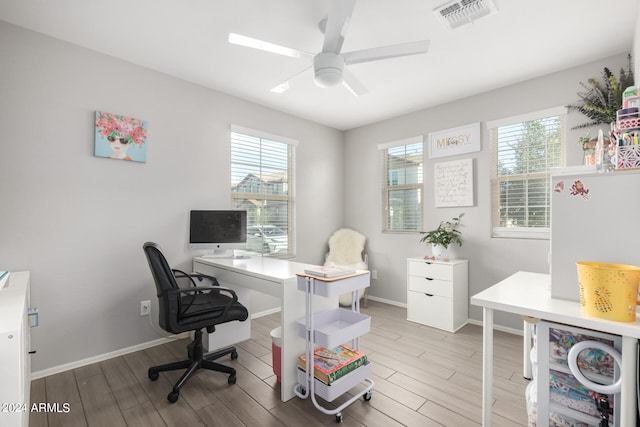 office with ceiling fan and hardwood / wood-style flooring