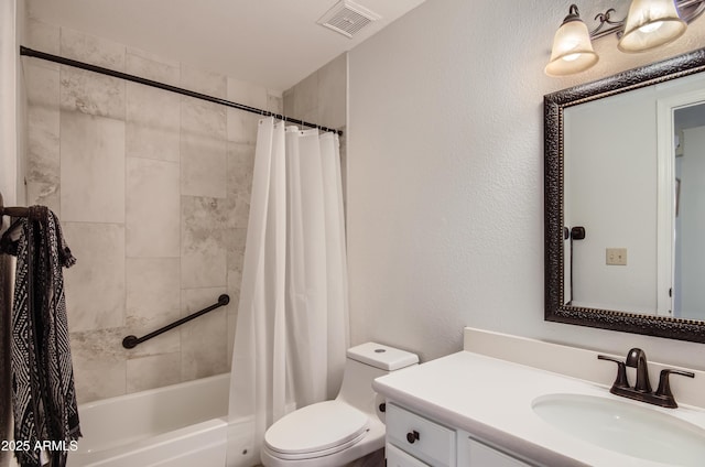 full bathroom featuring vanity, shower / tub combo with curtain, and toilet