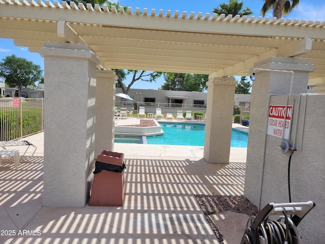 view of pool with a pergola and a patio