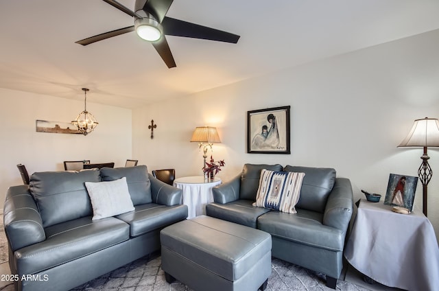 living room with ceiling fan with notable chandelier