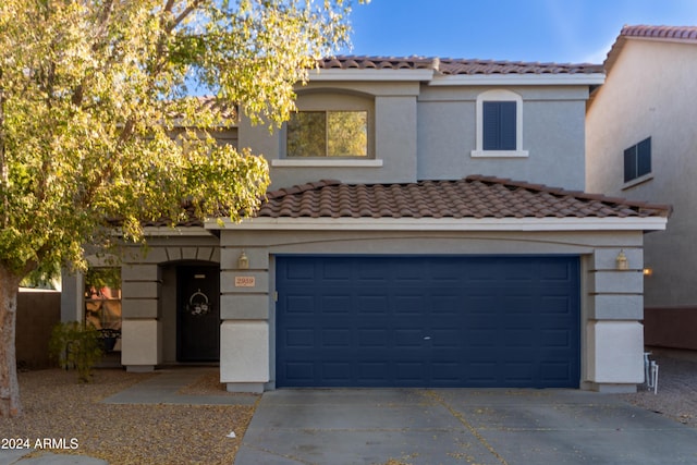 view of front of property with a garage