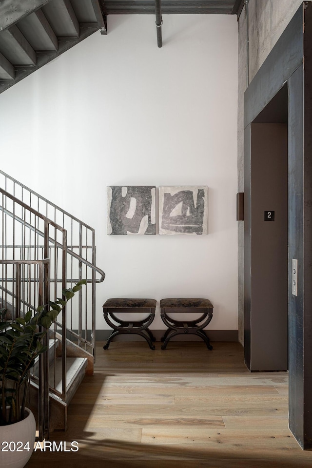 hall with wood-type flooring