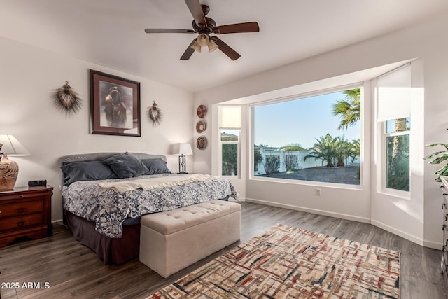 bedroom featuring dark hardwood / wood-style flooring and ceiling fan