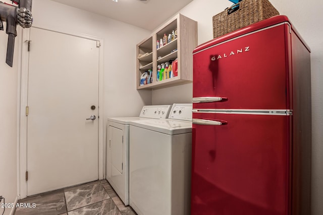 washroom featuring washing machine and dryer