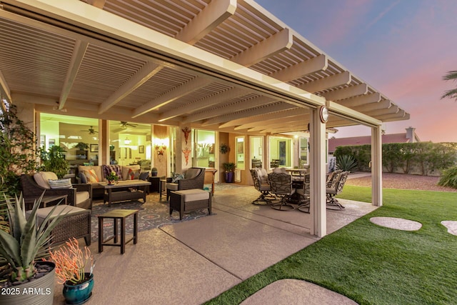 patio terrace at dusk featuring a pergola, a lawn, and outdoor lounge area