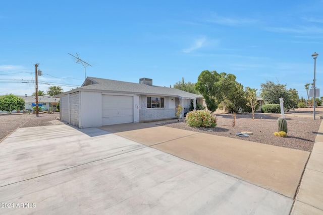 single story home featuring a garage