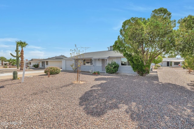 ranch-style home featuring a garage