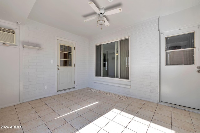 interior space with ceiling fan